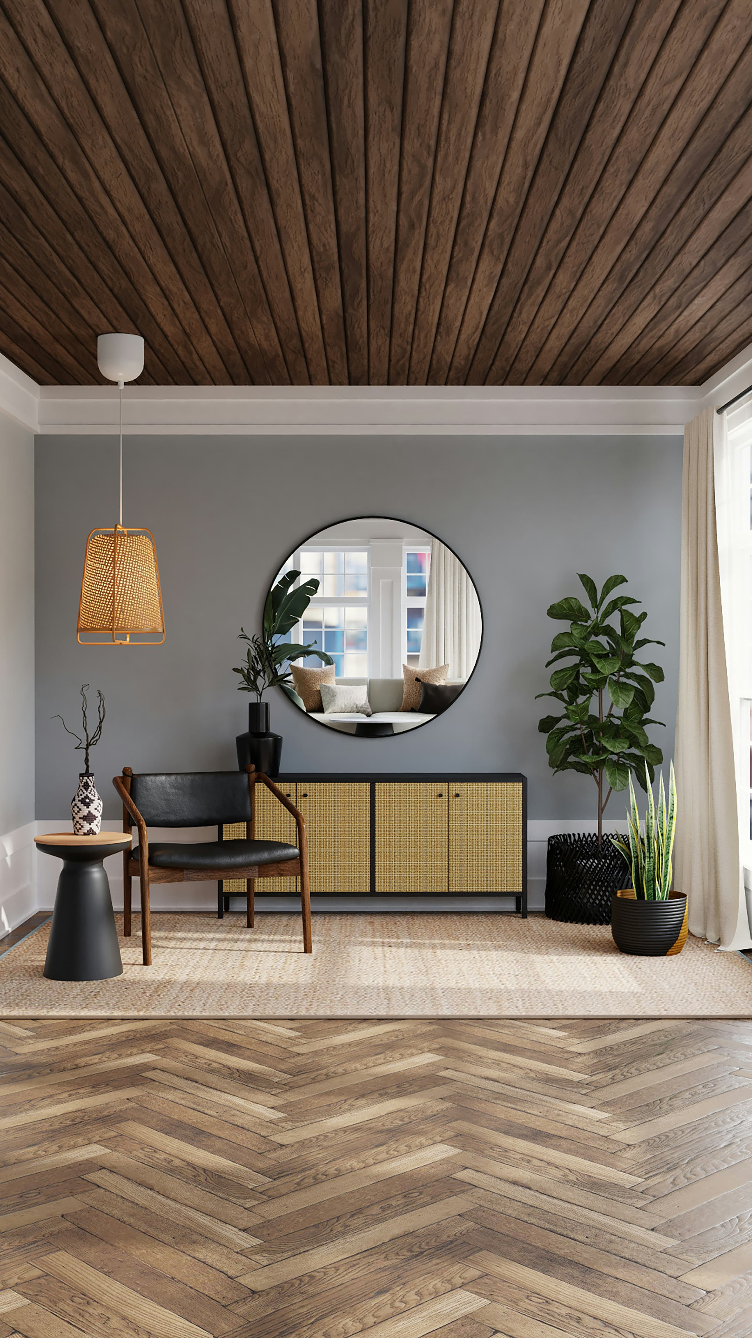 A dining table beneath a low pendant light