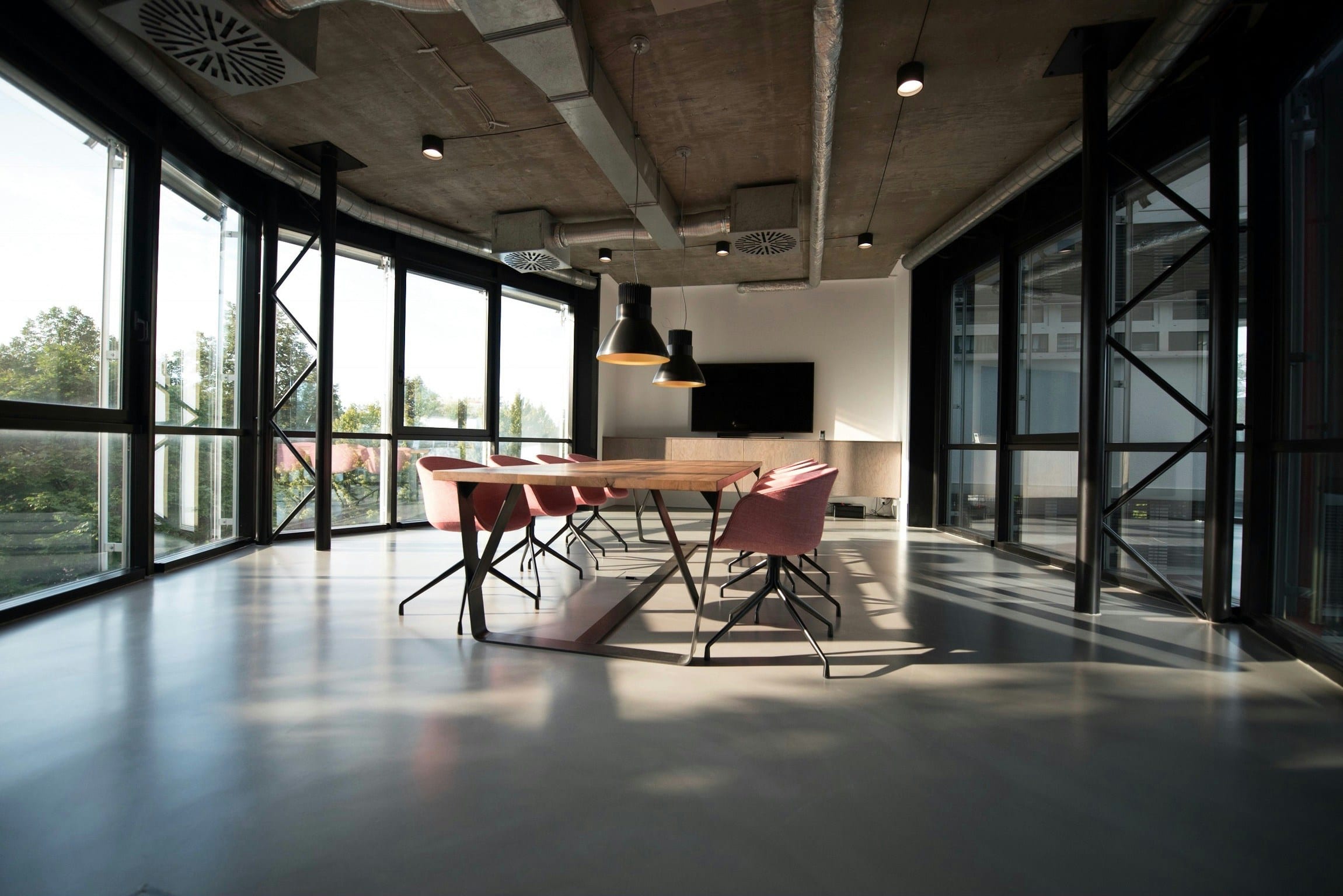 The Edit Suite — a warm, low-lit working room with soft surfaces