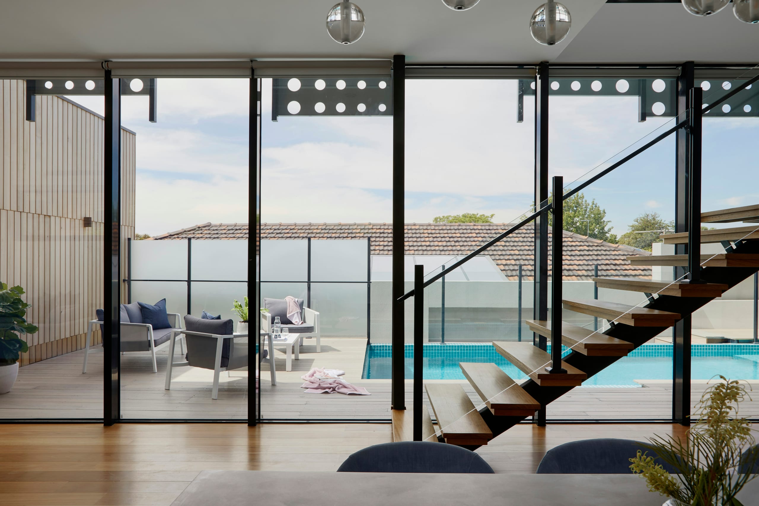 The Long Table — a narrow dining room built around one long teak table
